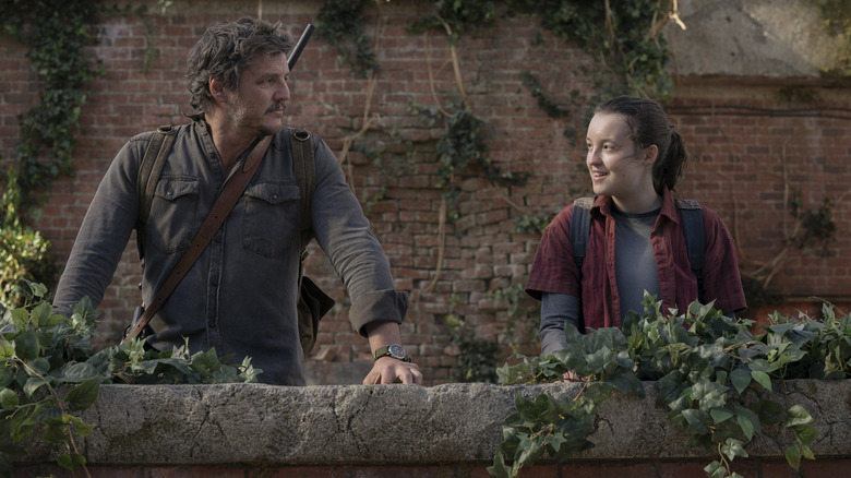 Joel and Elie smiles to each other outside at the end