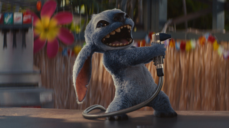 Stitch pointing a soda squirter gun in Lilo & Stitch