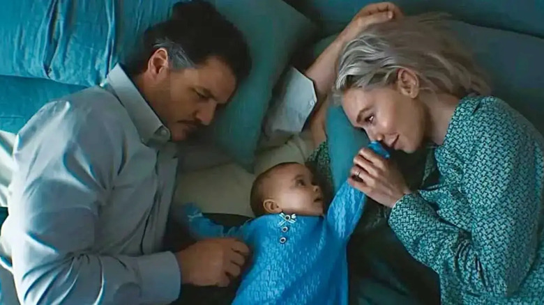 Reed and sue on both sides of their baby in bed in Fantastic Four: First Steps