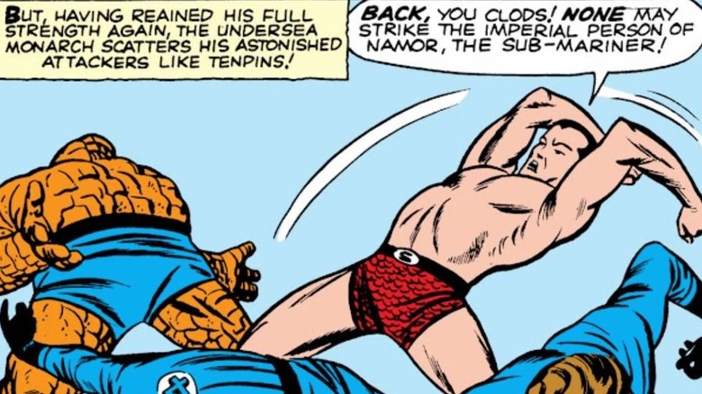 Namor beating up the Fantastic Four in Marvel Comics