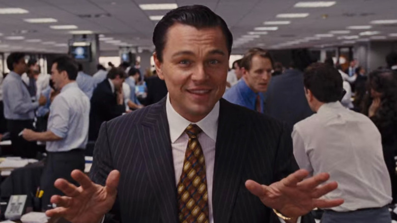 Jordan Belfort talking with hands raised