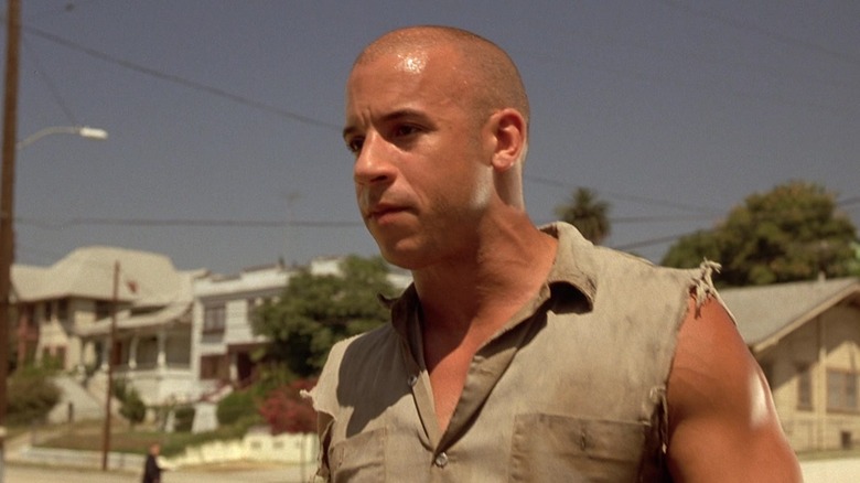 Dom standing outside on an L.A. street in The Fast and the Furious