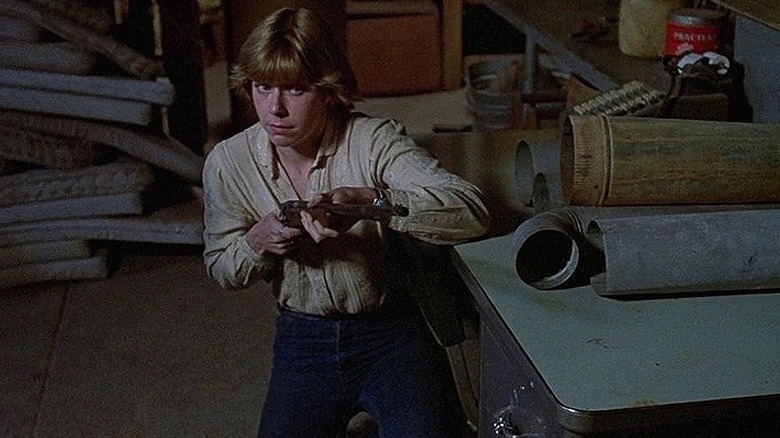 Adrienne King gun kneeling