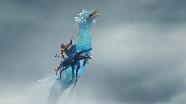 Aquaman and an octopus riding a seahorse