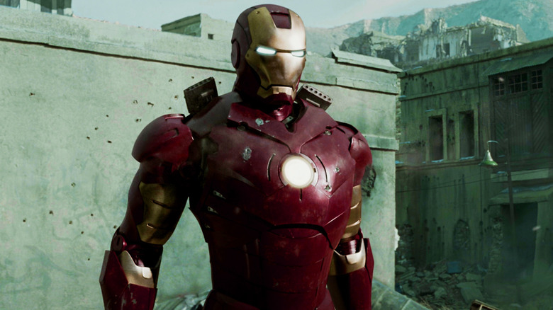 Iron man stands in a close place in the iron man