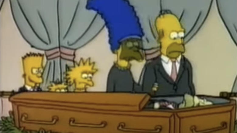 Keluarga Simpsons berdiri di atas peti mati Hubert Simpson dalam film pendek The Simpsons, The Funeral