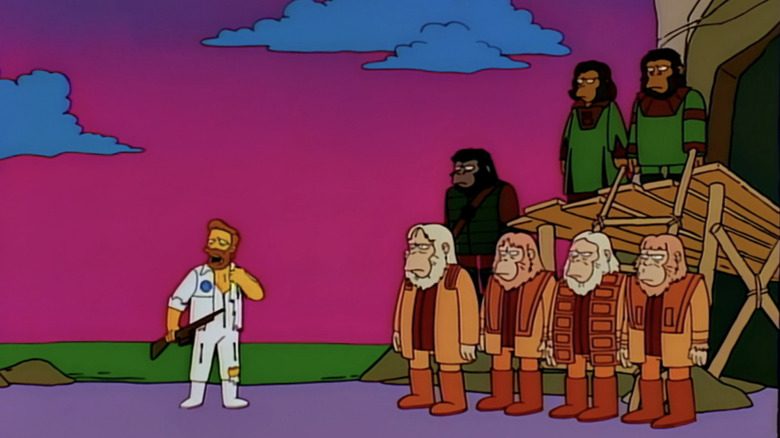 Troy McClure stands on-stage alongside apes in the musical Stop the Planet of the Apes, I Want to Get Off in The Simpsons