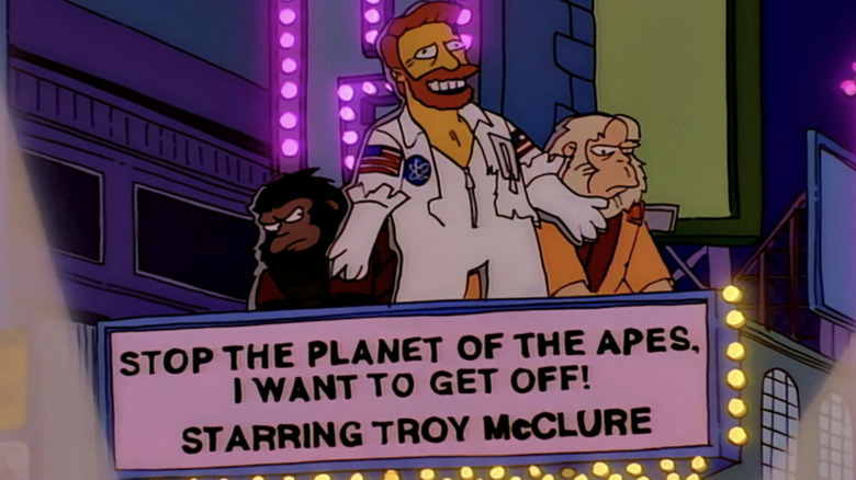 Troy McClure is seen on the marquee outside a theater for the musical Stop the Planet of the Apes, I Want to Get Off in The Simpsons