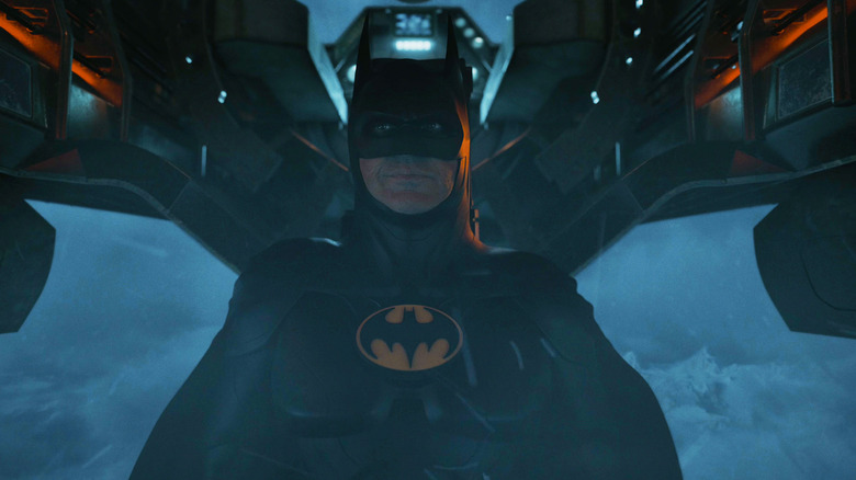 Michael Keaton's Batman sits in a plane in The Flash