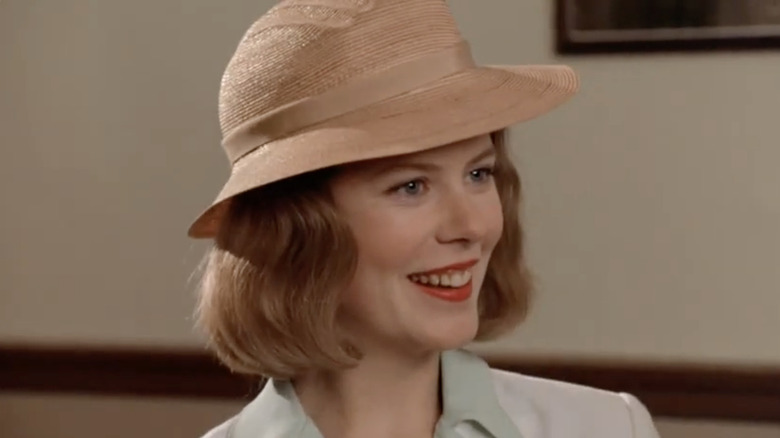Nicole Kidman as Drew Preston smiles as she wears a hat in Billy Bathgate