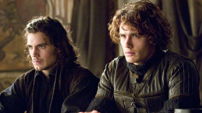 Henry Cavill as Melot and James Franco as Tristan sitting in shock in Tristan & Isolde