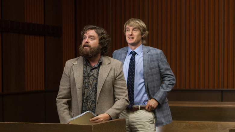 Ben and Steve in suits in a courtroom in Are You Here