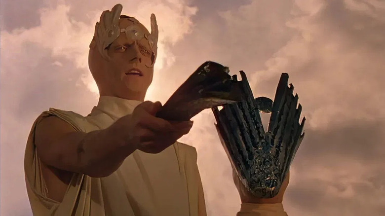 A Martian holding a Martian device in The Martian Chronicles