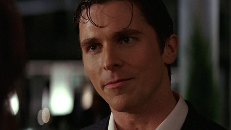 Christian Bale as Bruce Wayne looks thoughtful in the film 