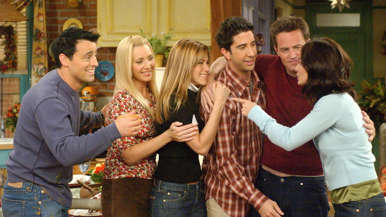 CANDER, Rachel, Ross, Joey, Phoebe, and Monica Looks embrace 