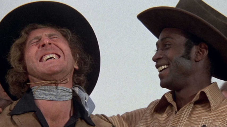 Jim the Waco Kid and Bart share a laugh in Blazing Saddles