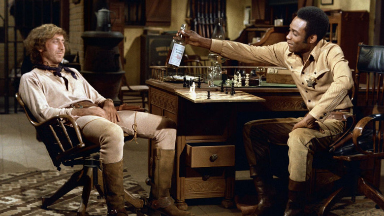 Jim the Waco Kid and Bart share a drink in Blazing Saddles