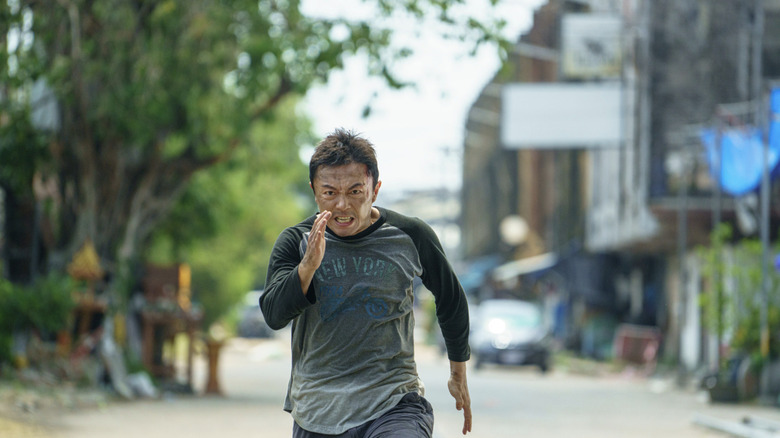 Wang runs and looks furious in The Furious