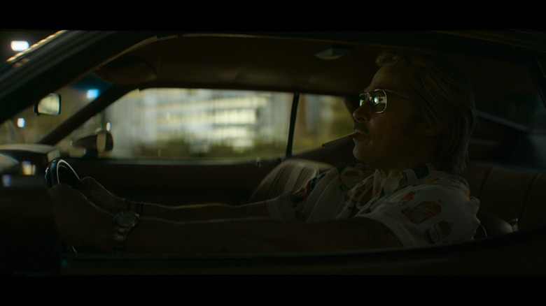 Cliff drives and smokes in The Further Mis-Adventures of Cliff Booth