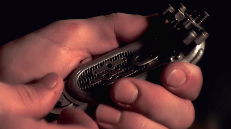 A close-up of a communicator prop fashioned from a razor