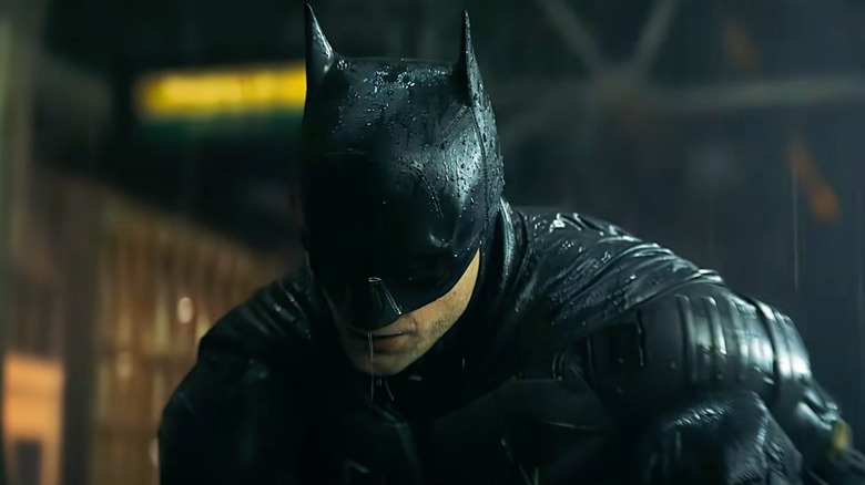 Batman in the rain, saying 