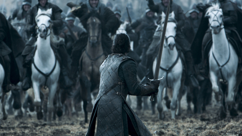 Jon holding a sword in front of Ramsay's army in Game of Thrones