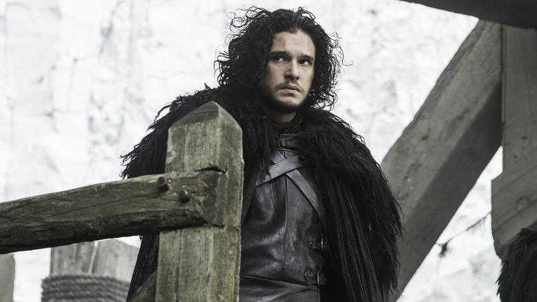 Jon Snow standing on the Castle Black stairs in Game of Thrones