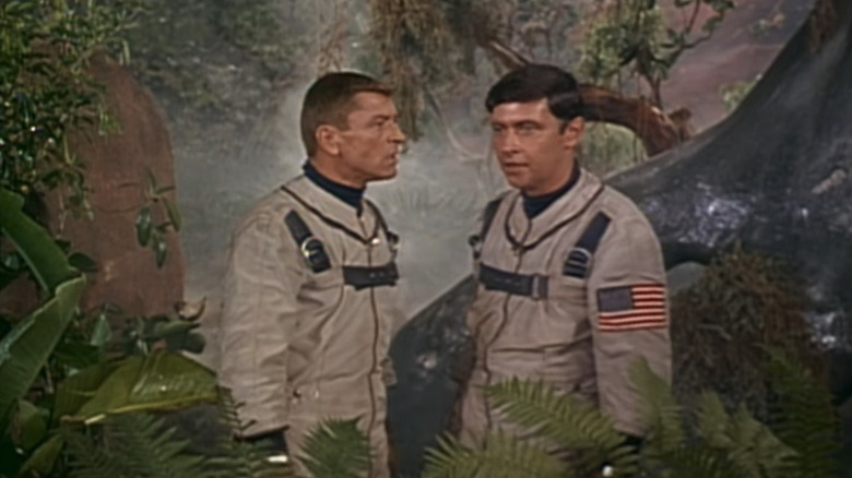 Frank Aletter's Mac McKenzie and Jack Mullaney's Hector Canfield stand side by side in a jungle in It's About Time