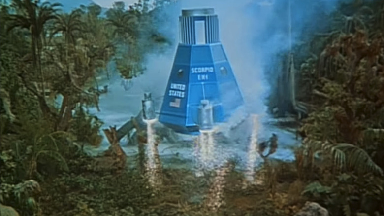 A space craft lands by a lagoon in It's About Time