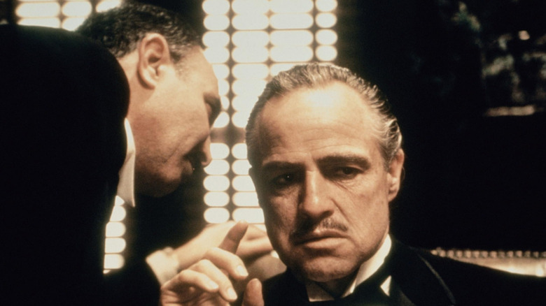 The Godfather, Amerigo whispering something in Vito Corleone's ear