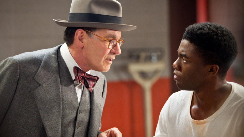 Harrison Ford talking to Chadwick Boseman
