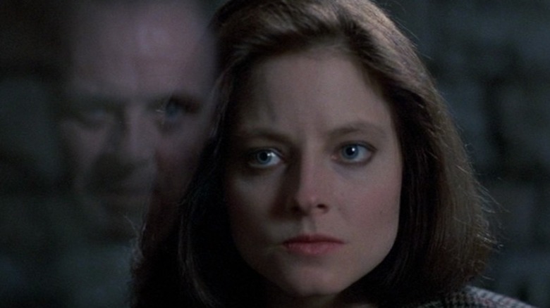 Jodie Foster looking intently at Anthony Hopkins