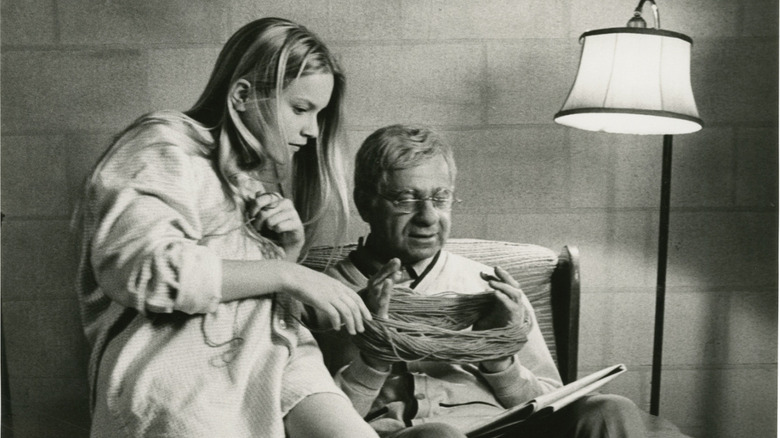 Walter Matthau plays with girl