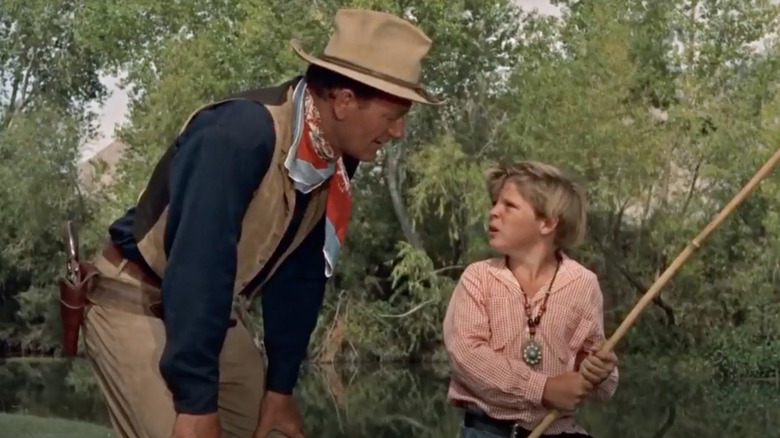 Hondo talks to a boy