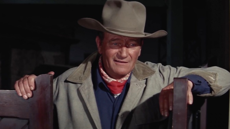G.W. stands in a doorway