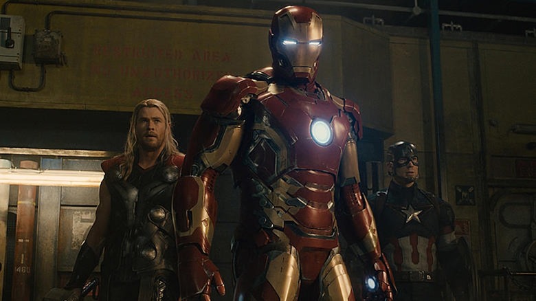 Robert Downey Jr as Iron Man takes center stage in front of Chris Hemsworth as Thor and Chris Evans as Captain America in Avengers: Age of Ultron