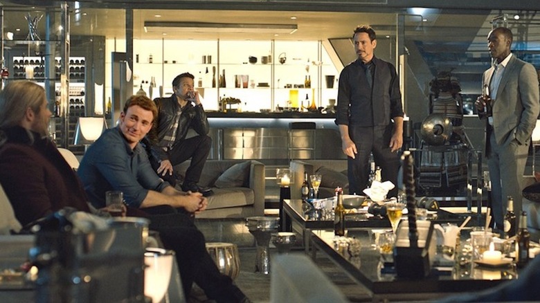 Chris Hemsworth as Thor, Chris Evans as Steve Rogers, Jeremy Renner as Clint Barton, Robert Downey Jr. as Tony Stark, and Don Cheadle as James Rhodes party at Avengers HQ in Avengers: Age of Ultron
