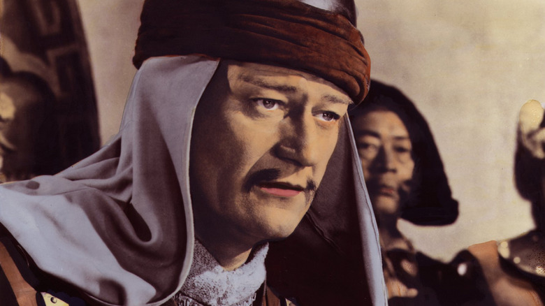 John Wayne looking on