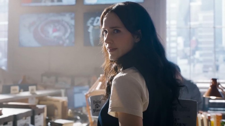 Lois looking over her shoulder at the Daily Planet office in Superman