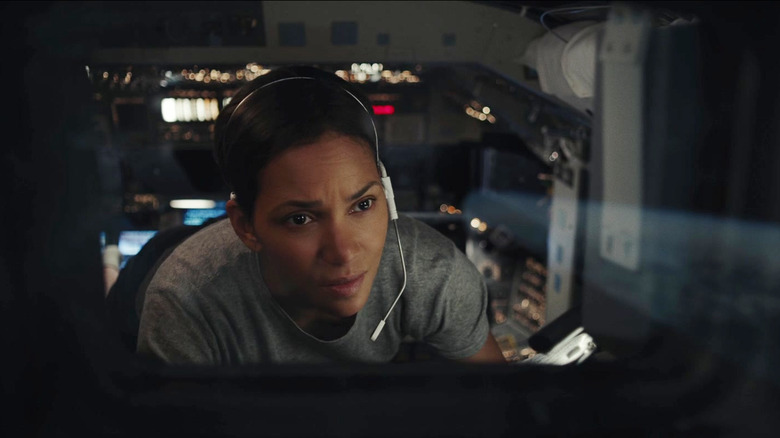 Halle Berry as Jocinda Fowler sitting on a space vessel in Moonfall