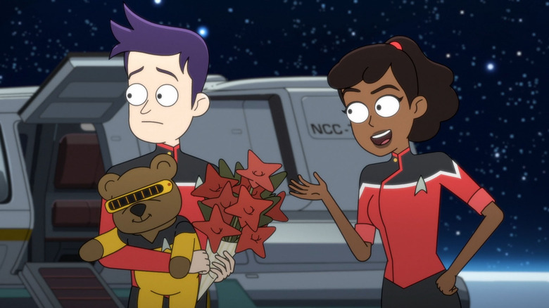 Ensign Boimler with a teddy bear and a bouquet next to Ensign Mariner on Star Trek: Lower Decks