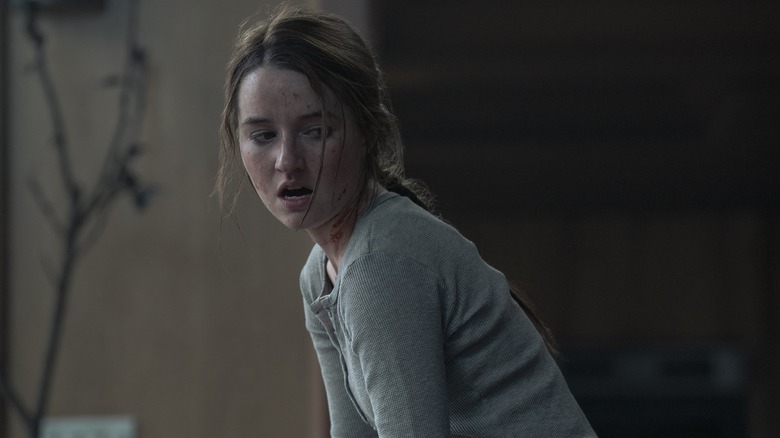 Abby with blood on her face gasping and looking to the side on The Last of Us