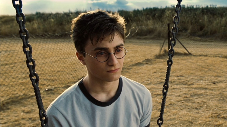 Order of the Phoenix, angry Harry sitting on the swings, the grass behind him dried out from heat/drought