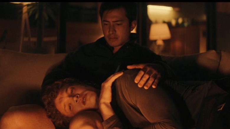 Shane and Ilya sitting in front of the fire on Heated Rivalry