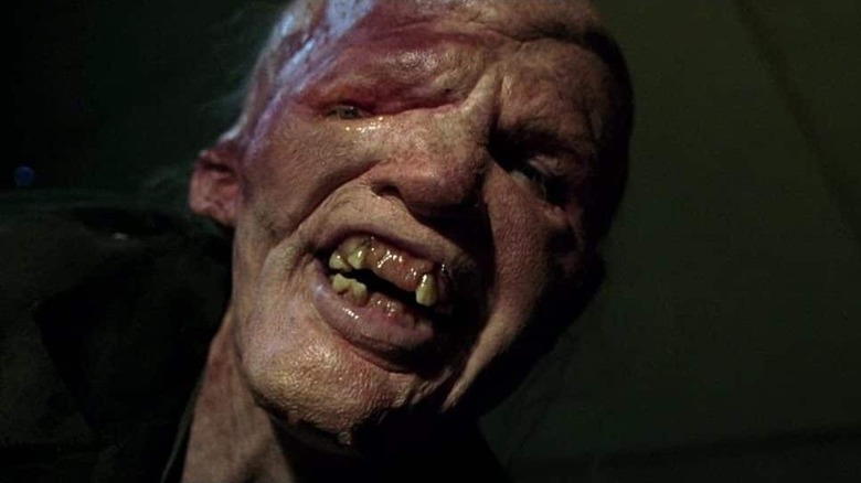 Mutant showing teeth in The Hills Have Eyes (2006)