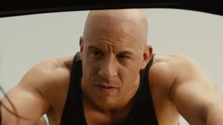 Dom Toretto leans over a car window