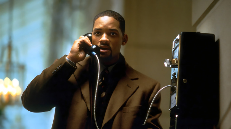 Robert Dean Clayton holding a payphone in 