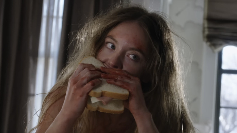 Millie eating a sandwich in The Housemaid