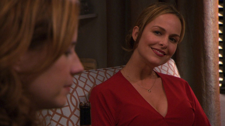 Jan (Melora Hardin) smiles in a leering fashion at Pam (Jenna Fischer) in The Office episode Dinner Party
