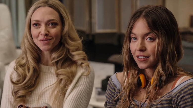 Nina and Millie on a couch in The Housemaid